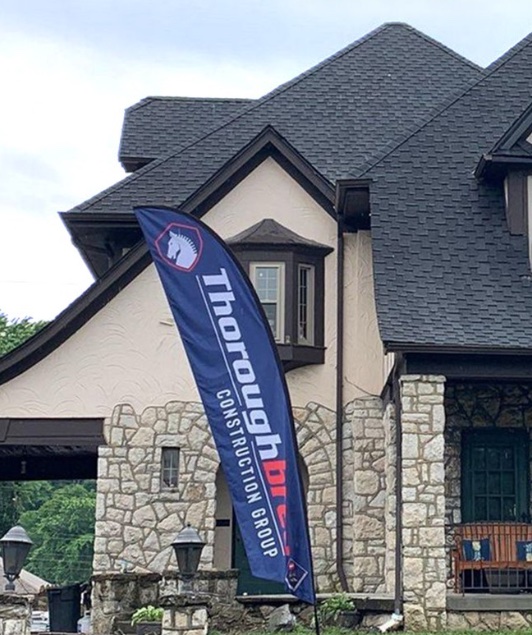 House with Thoroughbred Construction yard flag